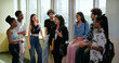 © Raushan_films - Indian happy young adult tutor lady woman group talk casual gossip have fun joy enjoy new day spend break time indoor place. Teen female girl pupil boy man male guy group mate speak share funny joke