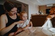 © looking2thesky - A cheerful 4-year-old girl prepares for breakfast in a bright morning living room. Authentic childhood moment of family routine and natural morning energy