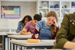 © Rido - Student girl feeling stressed during exam at secondary school