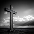 © Saidatul - A weathered wooden cross stands against a dramatic sky.