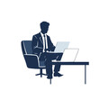 © pixmastock - Silhouette of a businessman working on multiple laptops in an armchair.