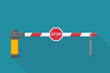 © Onidji - A red and white striped barrier gate in the closed position, featuring a red STOP sign. Concept for access restriction, security, or road block. Blue background. (flat design)