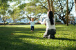 © Parichat - Baby taking first steps towards mother in park