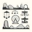 © mt graph - Vector art of collection of amusement park rides silhouettes including roller coasters, ferris wheel, carousel, and swing ride