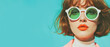 © NeuroCake - Stylish woman in retro sunglasses with bright orange lipstick. Pop art fashion and beauty portrait on a turquoise background. Summer banner with copy space