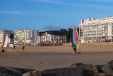 Windsurfing with wheels on the beach at Pornichet and La Baule in Brittany, France, in front of the sea and buildings typical of the region