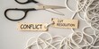 © Asraf - Scissors with Tags Representing Conflict and Cut Resolution Over Entangled White Cords on Light Background