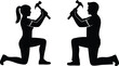 © MdTajemul - Silhouetted man and woman kneeling with raised hammers facing each other in dramatic pose, symbolizing confrontation, teamwork, or shared struggle