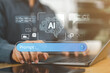 © Nirusmee - Man interacting with an AI chatbot prompt on a laptop, representing artificial intelligence, generative AI, virtual assistants, and smart content creation in modern multimedia technology.