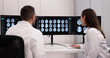 © Andrey Popov - Male Neurologist Monitoring Brain Scan On Computer Screen In Clinic