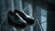 © Hansa & Party - Close-Up of Polished Black Loafers on a Reflective Office Floor, Perfect for Business Attire and Professional Settings