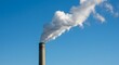 © Ramiel - Tall chimney emitting white smoke into a clear, bright blue sky on a sunny day