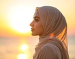 © dika - Portrait of a woman in headscarf against a golden sunset