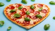 © Ummay - Heart shaped pepperoni pizza with fresh basil on blue background cheese