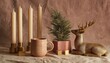 © MrHamster - Four slender cream candles sit alongside festive decorative elements on a draped surface