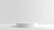 © TANJILAAMAN - A minimalist white cylindrical display podium is presented against a plain white background, featuring smooth edges and a matte surface, illuminated by soft, even lighting without shadows.