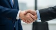 © Mujhid_Muneer - Successful business handshake seals the deal in modern office environment showing trust and partnership for corporate growth and collaborative success