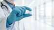 © MIkrom - Medical Professional In Blue Gloves Holds White Pill In A Bright Hospital Hallway