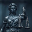 © Tanakrit - A detailed statue of Lady Justice, blindfolded, holding scales, symbolizing fairness and the judicial system.
