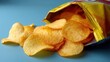 Crispy potato chips are scattered across a blue background as they spill out of a bright yellow bag. This snack offers a tasty treat perfect for sharing or enjoying alone.