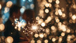 © Алексей Иванченко - Happy New Year 2026 greeting card, bokeh lights. Lovely couple with sparklers together near Christmas tree in room