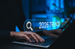 © Supatman - Trends 2026 year concept. Businessman using search bar with 2026 Trends text. Ideal for future technology, digital innovation, SEO marketing, market forecast, business strategy upcoming trend.