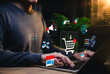 © Supatman - E-commerce and online shopping concept. Person using laptop with digital icons of cart, payment, review, delivery, and marketing, representing digital retail, consumer behavior and sales strategy.
