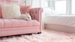 © tashechka - Cute white rabbit resting on a pink sofa in a cozy room