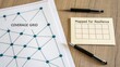 © putra - Detailed coverage grid diagram showcasing network connections with pens and a notepad emphasizing resilience mapping strategy