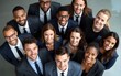 © ning - AI Generated Image top view of diverse group of professional businesspeople smiling confidently in formal attire representing teamwork and inclusivity. High quality