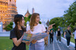 © Washburn - Female Tourists Exploring Temple with Map