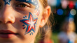 © Lexi - Girl with painted face showing stars and stripes during celebration
