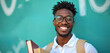 © Vadym - Portrait of smiling afro american man with books. Young guy with backpack is ready for study. Male student wearing eyeglasses poses near green wall is looking happy and confident.
