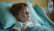© Vadym - Little boy sleeps soundly in hospital bed. Kid rests on pillow under a blanket. Sick child is taking nap during treatment. Cute toddler sleeps alone. Medical care and childhood.