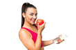 © luismolinero - Young beauty woman over isolated chroma key background with an apple and with a bottle of water