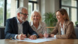 © Pete - Happy senior couple meets financial agent, signs important documents. Smile, agree to contract at office table. Old man, woman plan future, discuss terms. Business consultant explains details to