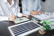 © Charlie's - Solar panels green energy Business man working green eco friendly office business creative idea Planing Bio economy for business eco friendly professional Engineer sustainable electricity.