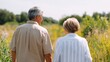 © Z A C - Older couple walking through a field of corn.