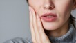 © Nermin - Portrait of a young woman experiencing toothache and dental pain