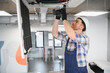 © Serhii - Hvac technician installing air conditioning unit in office building