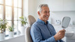 © Taras Roshchuk - Senior man smiles while checking his reflection in a mirror during dental appointment in bright clinic