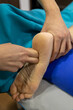 © Ardi - A professional giving a therapeutic foot massage, enhancing health and well-being of patient.