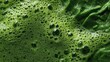 © PrettyVectors - Green smoothie juice texture closeup. Kale and spinach blend. Natural organic surface with foam
