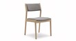 © Tasa - Modern wooden chair with upholstered seat and backrest against a white backdrop
