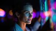 © Pedro - A woman looking at the neon light sign. She wears a professional attire, her expression reflecting curiosity and engagement.