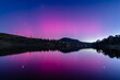 © Merrillie - Aurora Australis display lights up the sky in pinks over the dam