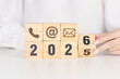 © Jo Panuwat D - Happy New Year 2026 block for Contact Us concepts. Wood block of Email, call Phone and Website Address sign. For Customer support hotline, business Marketing, Corporate, communication and Advertising