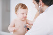 © peopleimages.com - Baby, stethoscope and doctor with checkup, healthcare and wellness with examination. Paediatrician, patient and child with appointment, heartbeat and medical attention with test and consulting