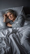 © D-point - Sad caucasian senior woman with grey hair lying awake in bed at night. Sleep disorder, insomnia, stress, and anxiety in older age concept for healthcare.