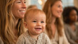 © CinimaticWorks - smiling baby attending parenting class with mothers portrait showing caring supportive environment infant development childcare and family connection